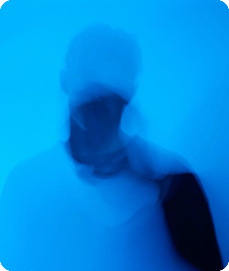 A figure diffused in bright blue light