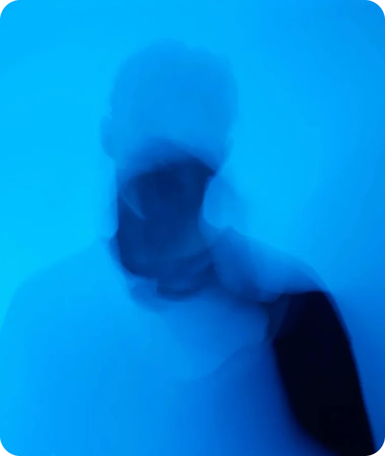 A figure diffused in bright blue light